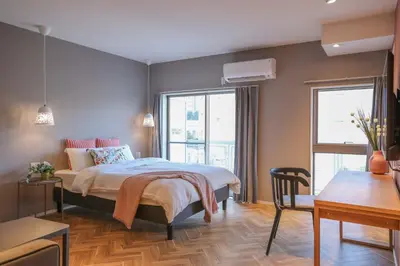 a bedroom with a bed and a table and chairs at Shinjuku Waseda Hostel-SJ0147 in Tokyo