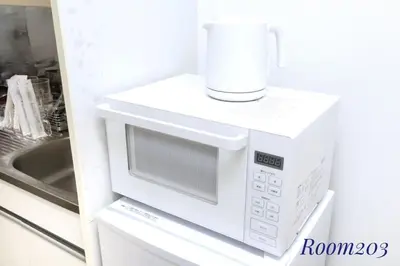 a white microwave with a cup on top of it at Avanti Room 203-301 - Vacation STAY 68751v in Tokyo