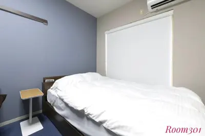 a bedroom with a white bed and a window at Avanti Room 203-301 - Vacation STAY 68751v in Tokyo