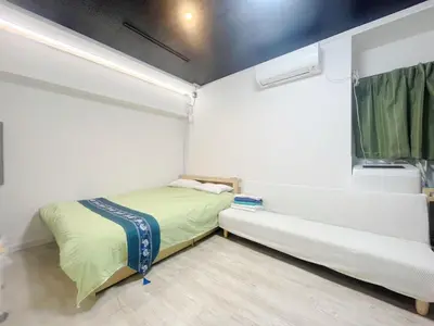 a small bedroom with a bed and a window at Toshima-ku - House - Vacation STAY 17454 in Tokyo