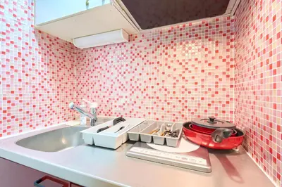 a kitchen with pink tiled walls and a sink at N1-2Shinjuku luxury house with EV Max6P in Tokyo