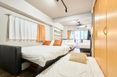 a bedroom with two beds and a couch at N2-3Shinjuku luxury house with EV Max6P 4min to Sta in Tokyo