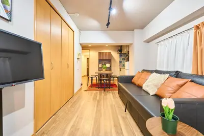 a living room with a couch and a flat screen tv at N2-3Shinjuku luxury house with EV Max6P 4min to Sta in Tokyo