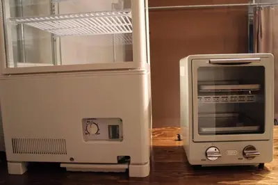 a toaster oven sitting next to a microwave at Rakuna Inn \u548c Honjo-Azumabashi in Tokyo