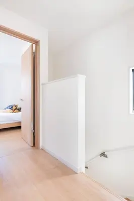 an open door to a bedroom with a bed at \u5343\u4f4f\u6cb3\u539f\u753a2f 3f in Tokyo