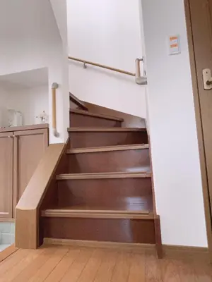 a staircase in a house with wooden floors at 120\u5e73\u7c73 5BR House, Near Ueno and Asakusa, Parking 2\u95f4\u6d74\u5ba45\u5ba41\u5385 FlowerTea Hotel in Tokyo