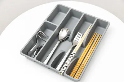 a tray with silver utensils on a plate at FIKA Shibuya Honmachi 101 in Tokyo