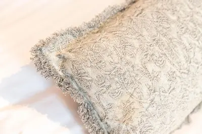 a white lace pillow sitting on a table at FIKA Shibuya Honmachi 101 in Tokyo