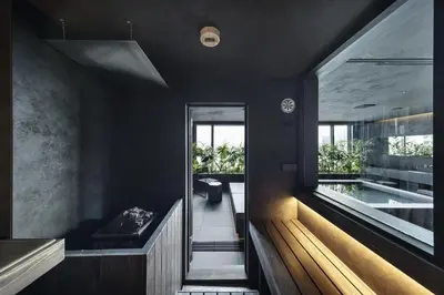 a bathroom with a swimming pool and a tub at YUURO Bath-Living Hotel Ryogoku in Tokyo