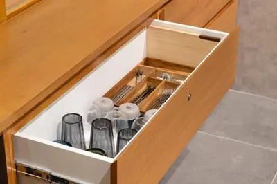 a drawer in a kitchen with cups and dishes at YUURO Bath-Living Hotel Ryogoku in Tokyo