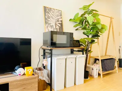 a room with a tv and a computer on a table at Alo BnB 12 - Game Universe - Easy Access to Shibuya - New ! in Tokyo
