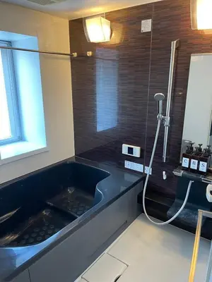 a bathroom with a shower with a black tub at Walk to Asakusa, Sky tree MAX16P in Tokyo