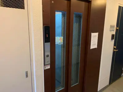 a row of glass elevators in a building at Walk to Asakusa, Sky tree MAX16P in Tokyo