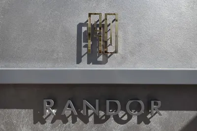 a sign on the side of a building with the word remorc at Randor Residence Tokyo Grand in Tokyo