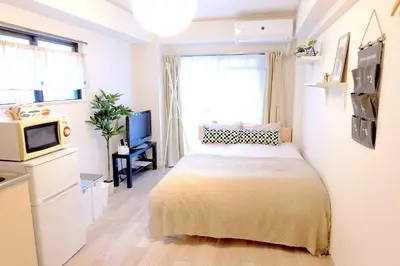 a small bedroom with a bed and a television at Heisei Mansion - Vacation STAY 17520 in Tokyo