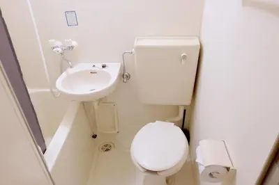 a small bathroom with a toilet and a sink at Heisei Mansion - Vacation STAY 17520 in Tokyo