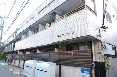 a building with a truck parked in front of it at Heisei Mansion - Vacation STAY 17520 in Tokyo