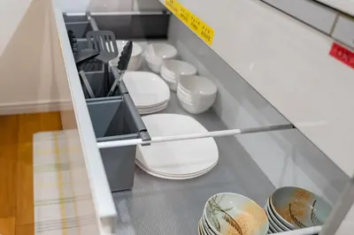 a drawer filled with white plates and utensils at Kita Akabane-Diamond Yu - Vacation STAY 84219v in Tokyo