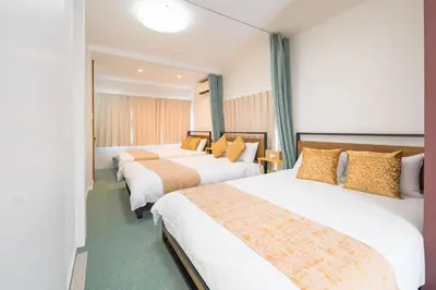 a hotel room with two beds and a window at Kita Akabane-Diamond Yu - Vacation STAY 84219v in Tokyo