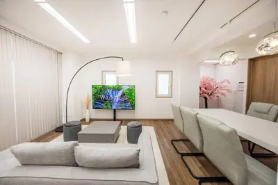 a living room with a couch and a table at \u6e0b\u8c37\u99c5\u96fb\u8eca1\u5206 \u6075\u6bd4\u5bff\u99c5\u5f92\u6b692\u5206 85\u5e73\u7c73\u6700\u59276\u540d \u6771\u4eac \u65b0\u5bbf \u4e0a\u91ce \u9280\u5ea7 \u6c60\u888b \u7bc9\u5730\u76f4\u901a in Tokyo