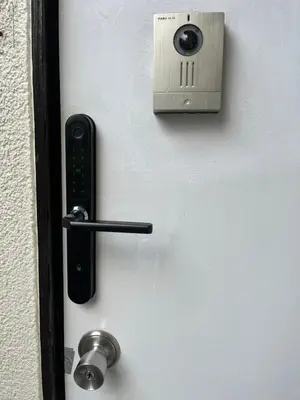 a door with a cell phone and a door knob at \u897f\u6c60\u888b\u4e4b\u5bb6 in Tokyo