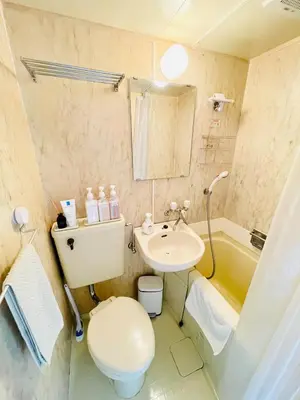 a bathroom with a toilet and a sink and a tub at Alo BnB 14 - Cats and Coffee - Near Shibuya ! Self check-in in Tokyo