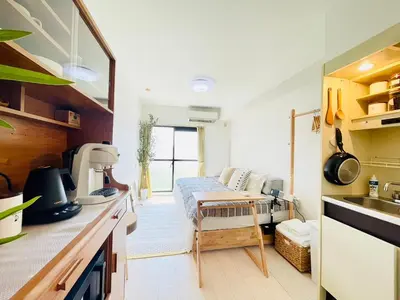 a kitchen with a sink and a table in a room at Alo BnB 14 - Cats and Coffee - Near Shibuya ! Self check-in in Tokyo