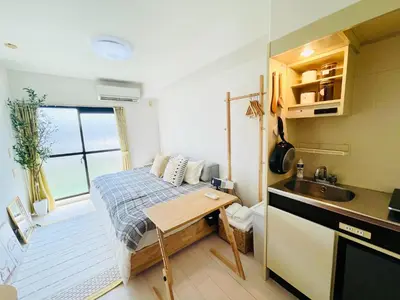a small kitchen with a bed and a sink at Alo BnB 14 - Cats and Coffee - Near Shibuya ! Self check-in in Tokyo