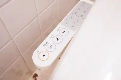 a white remote control in a bathroom at Yoyogi Flats - Vacation STAY 17486 in Tokyo