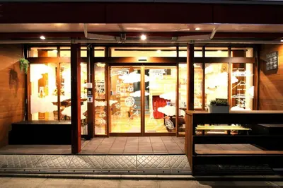 a store front with glass doors of a restaurant at Rakuna Inn \u6cb3 Oshiage in Tokyo
