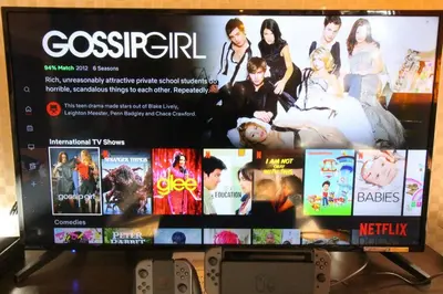 a flat screen tv with a video game on it at Rakuna Inn \u6cb3 Oshiage in Tokyo