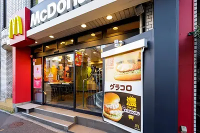 a mcdonalds restaurant with an advertisement for a hamburger at \u590f\u76ee\u5742\u306e\u9593Room2 in Tokyo