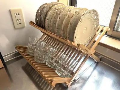 a rack of glasses sitting on a table at NOT A HOME\u4e80\u6709 \u99c5\u5f92\u6b695\u5206 \u7121\u6599\u99d0\u8eca\u5834 \u30c7\u30a3\u30ba\u30cb\u30fc\u307e\u3067\u8eca22\u5206 \u7fbd\u7530\u7a7a\u884c\u30d0\u30b9\u76f4\u901a 90m2 in Tokyo