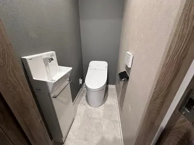 a small bathroom with a toilet and a sink at COTO Premium Shibuya B in Tokyo