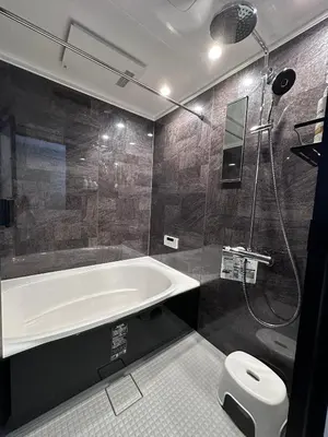 a bathroom with a tub and a shower and a toilet at COTO Premium Shibuya B in Tokyo