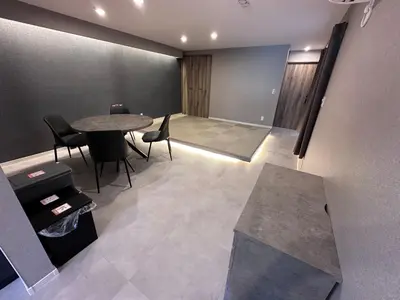 a meeting room with a table and chairs in a room at COTO Premium Shibuya B in Tokyo
