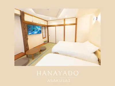 a hotel room with two beds and a window at \u82b1\u5bbf\u6d45\u8349\u4e8c\u756a Hanayado Asakusa2 in Tokyo