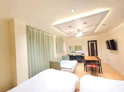 a hospital room with two beds and a dining room at \u82b1\u5bbf\u6d45\u8349\u4e8c\u756a Hanayado Asakusa2 in Tokyo