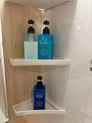 two bottles ofodorizers sit on shelves in a refrigerator at \u5343\u4f4f\u5bff\u753a1f in Tokyo