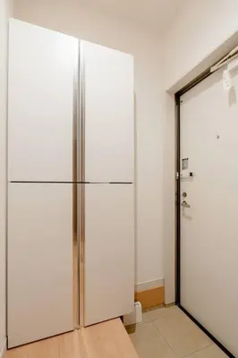 a large white refrigerator in a room at \u5343\u4f4f\u5bff\u753a1f in Tokyo