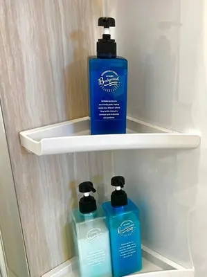 two bottles ofodorizers sit on a shelf in a refrigerator at \u5343\u4f4f\u5bff\u753a2f 3f in Tokyo