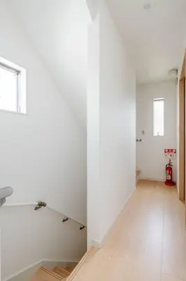 a room with white walls and a hard wood floor at \u5343\u4f4f\u5bff\u753a2f 3f in Tokyo