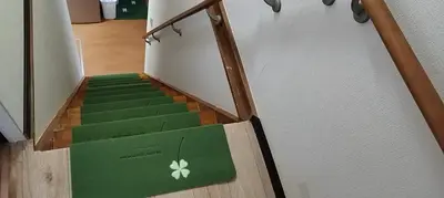 a stairway with a green box with a flower on it at kyoka house\u6c60\u888b\u81f3\u8fd1 in Tokyo