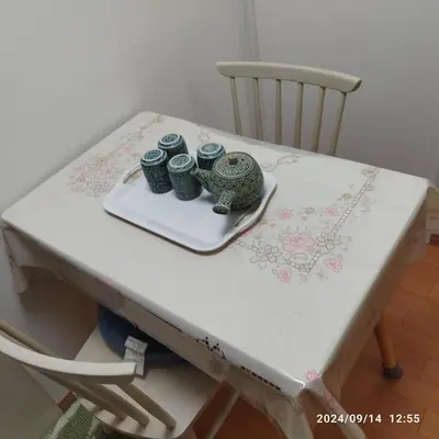 a white table with three jars on top of it at kyoka house\u6c60\u888b\u81f3\u8fd1 in Tokyo