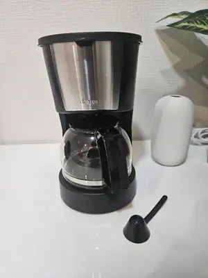 a black blender sitting on top of a counter at \u7d50\u5eb5\u6708\u82b1 in Tokyo