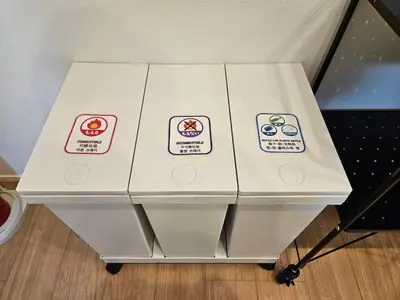 a white table with four stickers on it at \u516b\u5e836\u4e01\u76ee in Tokyo