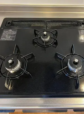 a stove top with three burners on top of it at \u516b\u5e836\u4e01\u76ee in Tokyo