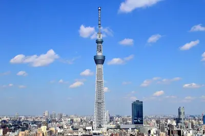 a tall tower in the middle of a city at \u516b\u5e836\u4e01\u76ee in Tokyo