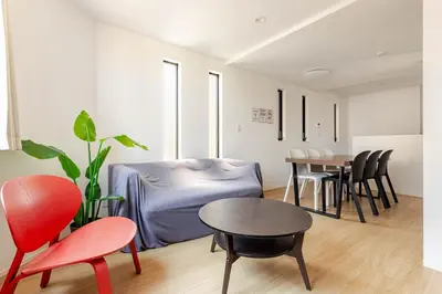 a living room with a table and chairs at \u516b\u5e836\u4e01\u76ee in Tokyo