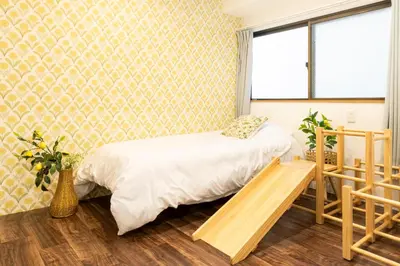 a bedroom with a bed and a window at HARMONIa\u6771\u4eac\u5800\u5207202 in Tokyo